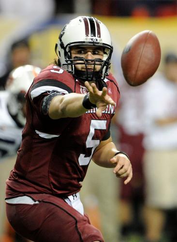 Dec 4, 2010; Atlanta, GA, USA; South Carolina Gamecocks quarterback Stephen Garcia (5) pitches the ball on an option run during the first half of the 2010 SEC championship game against the Auburn Tigers at the Georgia Dome. Mandatory Credit: John David Mer