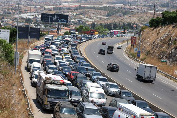 Displaced people make their way back to their homes in southern Lebanon following an interim deal between the U.S. and Iran, in Sidon