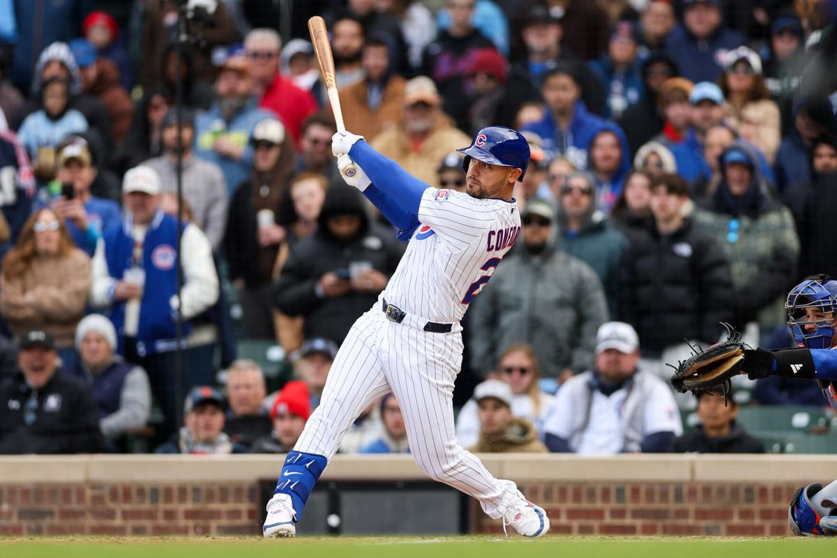 The Chicago Cubs' Michael Conforto hits an RBI double during the ninth inning against the New York Mets at Wrigley Field on April 19, 2026, in Chicago.