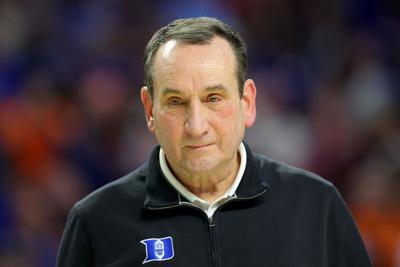 Duke head coach Mike Krzyzewski walks off the court after defeating Michigan State, 85-76 in the second round of the NCAA Tournament at Bon Secours Wellness Arena on March 20, 2022, in Greenville, South Carolina.