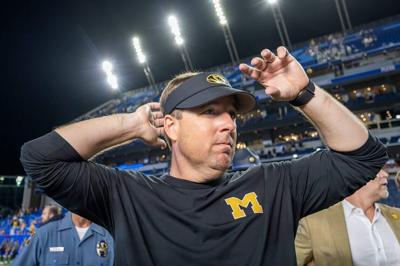 Missouri head coach Eli Drinkwitz on the field after defeating a 38-21 win against Kansas in the Border War at David Booth Kansas Memorial Stadium on Sept. 11, 2026, in Lawrence, Kansas.