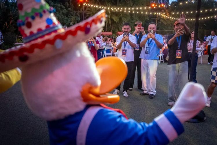 Influencers and content creators gather to take photos and video of Disney characters.