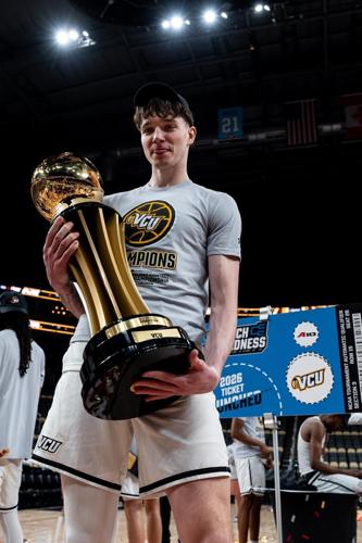 VCU's Lazar Djokovic holds A-10 tournament trophy