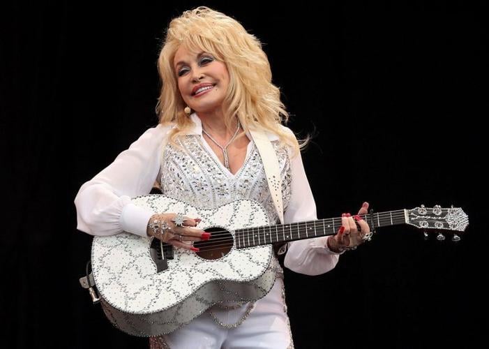 American country music star Dolly Parton performs in Somerset, England, during the Glastonbury Festival in 2014.