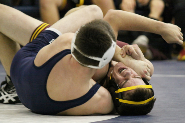 Abingdon wrestler taking charge on mat, classroom