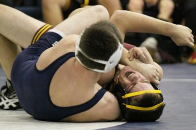 Abingdon wrestler taking charge on mat, classroom