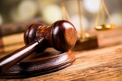 Golden scales of justice, books, Statue of Lady Justice. Owl and paragraph