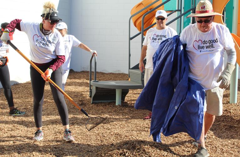 Volunteers swing into action to build new Bob Sierra YMCA playground