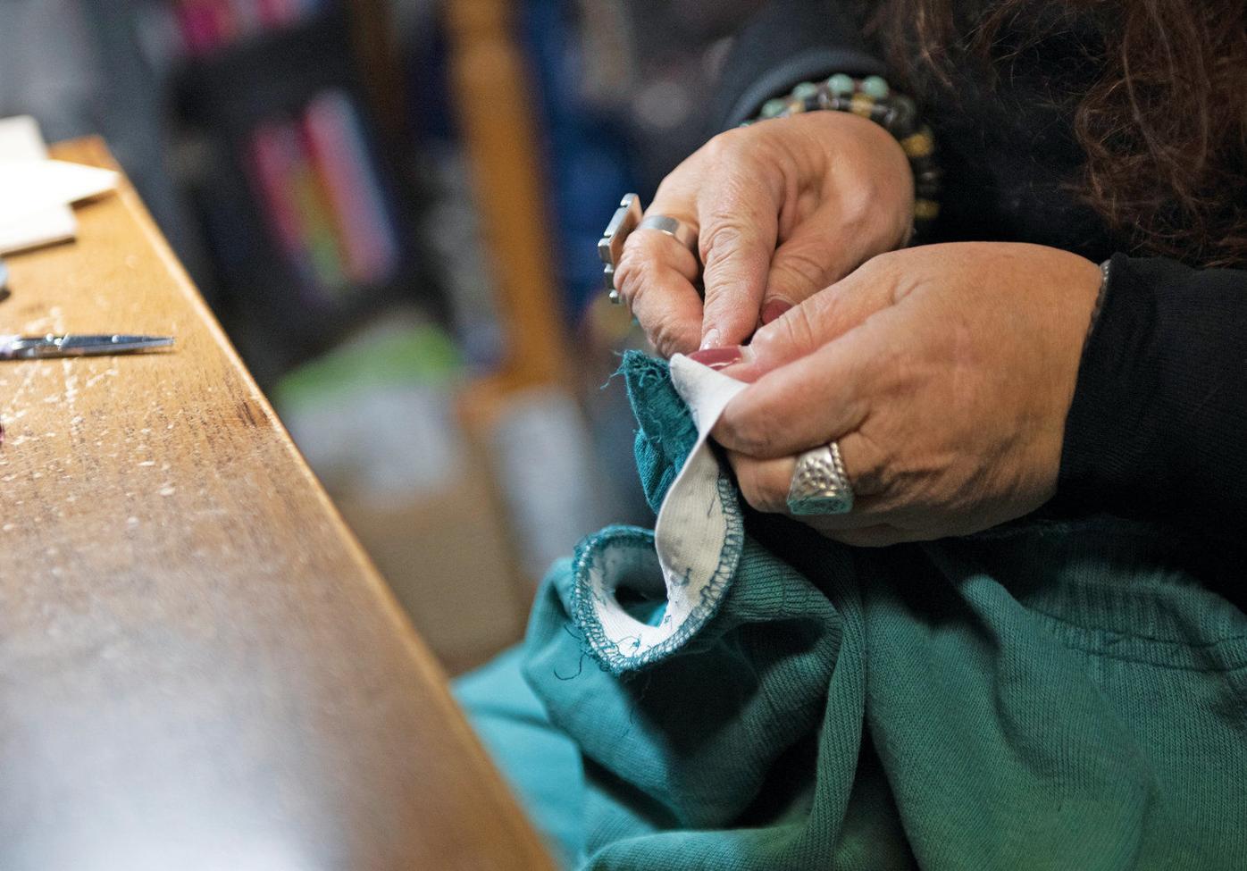 Seamstress/tailor Lynn Beheler creates new items, repairs old ones