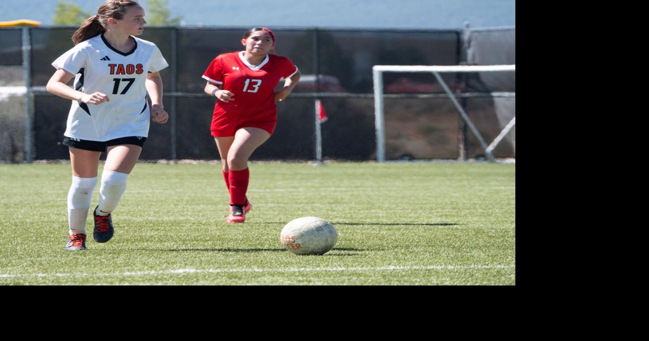Lila Delaney dribbles up the pitch