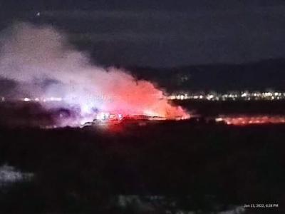 Home fully engulfed in Carson west of Taos