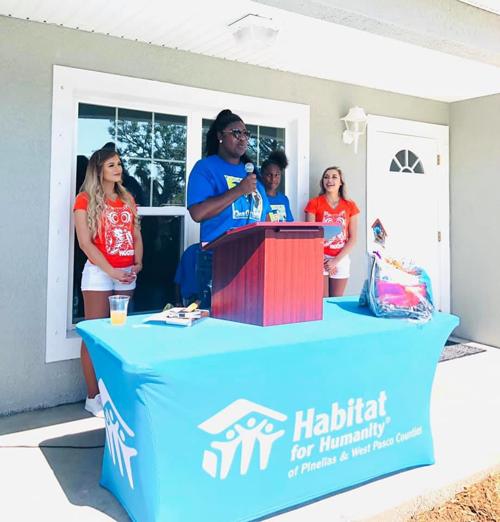 Hooters employees help build Habitat home for Largo family