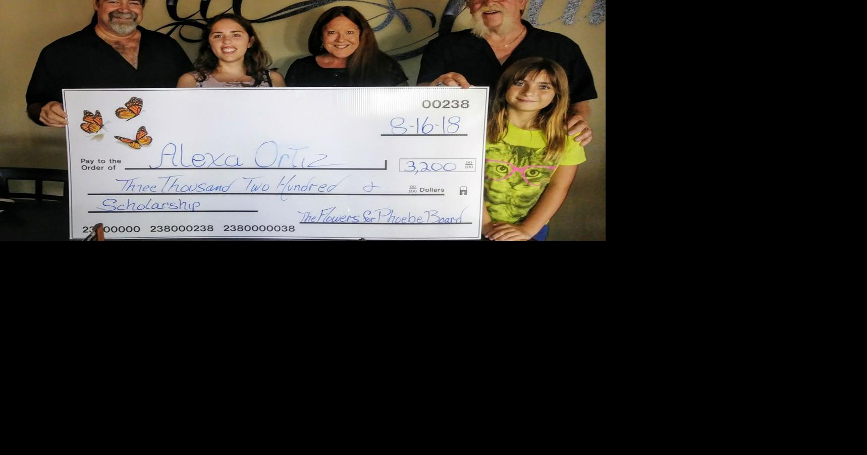 Flowers for Phoebe Board presents scholarship check
