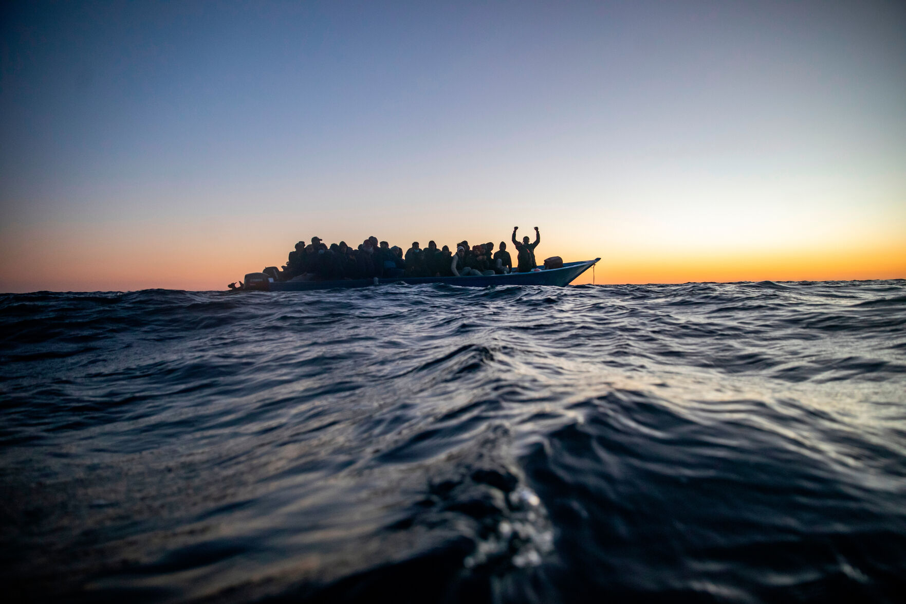 Aid group says Libyan-linked vessels fired on a migrant rescue ship in ...
