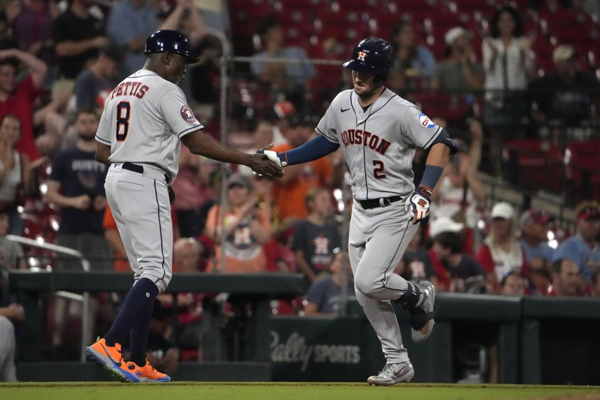 Jose Altuve of the Houston Astros high fives Gary Pettis hitting a