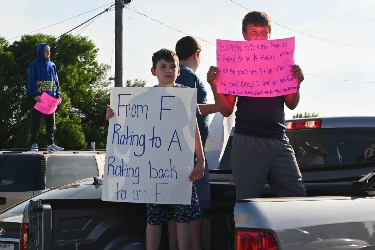 Students protest Buckholts ISD trustees; School board members urged to