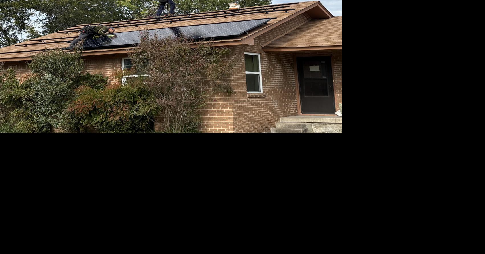Workers install solar panels recently on East Comay Circle in Belton, TX