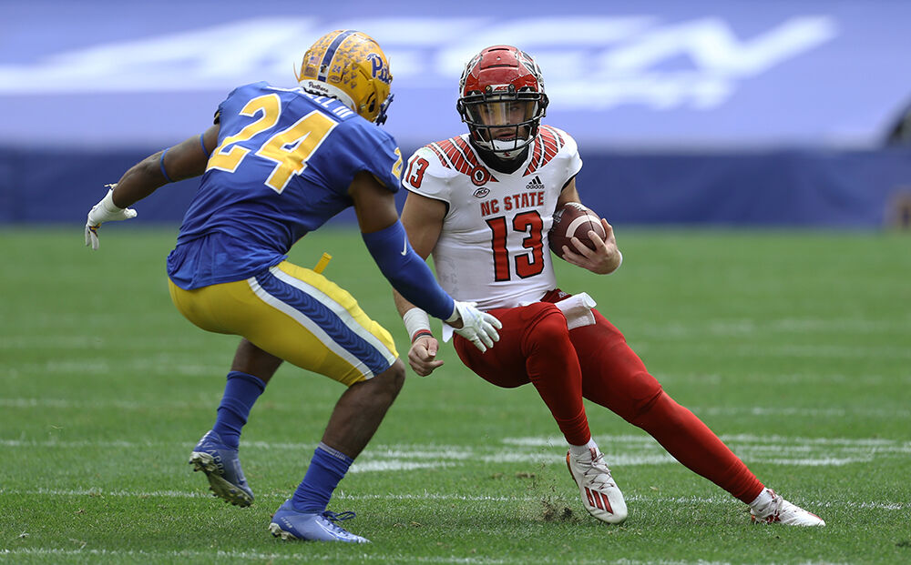 North Carolina State quarterback Devin Leary (13) plays against Pittsburgh  Panthers during an N …