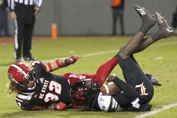 Louisville Defense Declaws The Wolfpack's Offense 