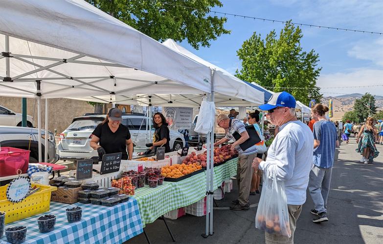 Visitor Guide Farmers market features fresh produce, baked goods, live