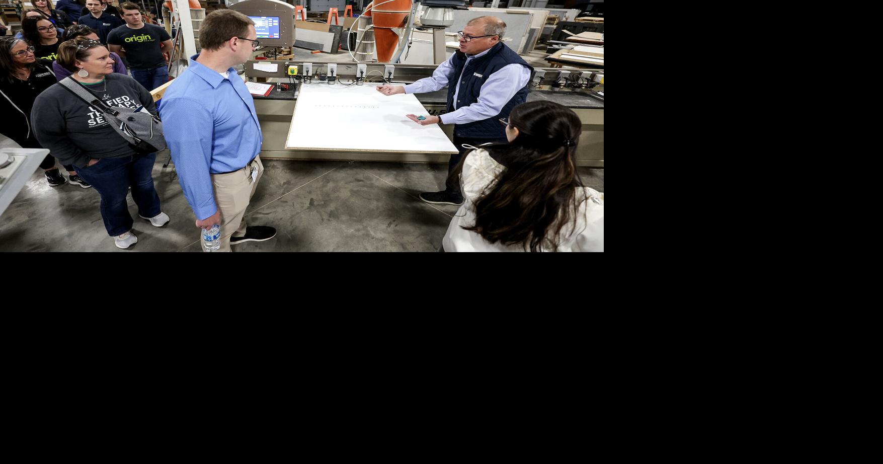 Cabinet manufacturer showcases expanded facility on Dubuque chamber tour