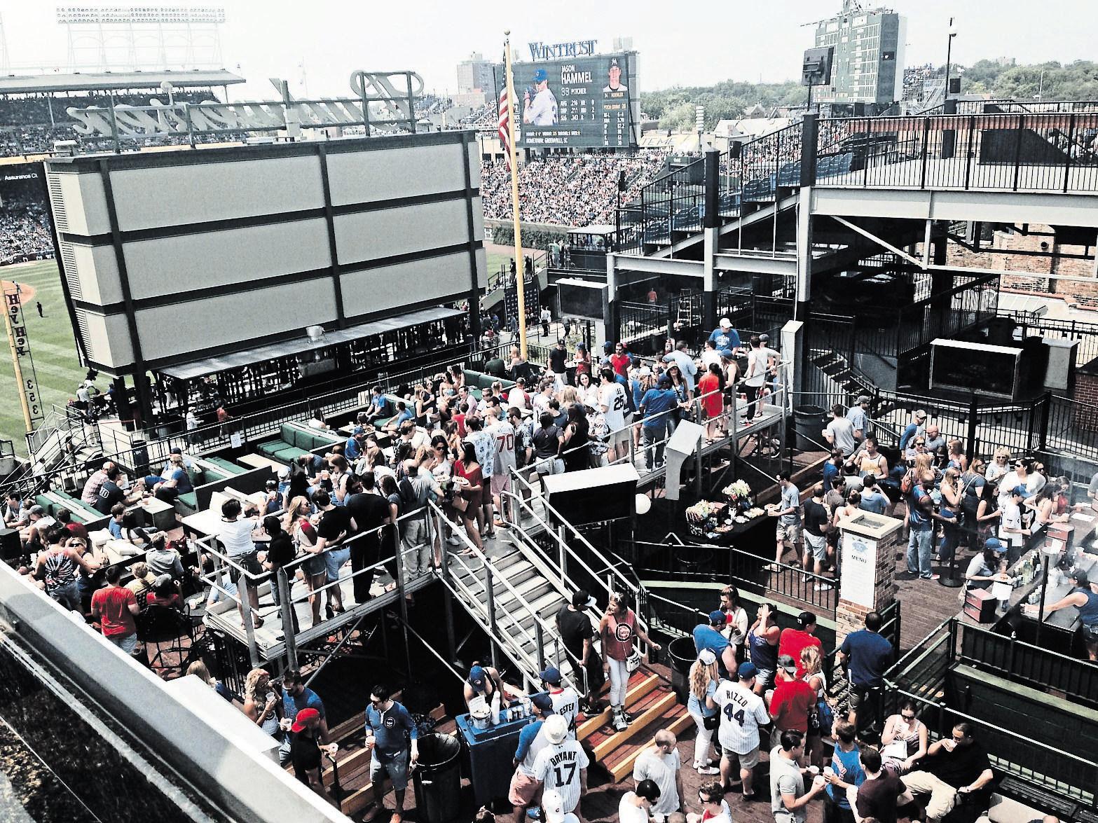 wrigley field,rooftop bleachers at wrigley,ivy covered outfield