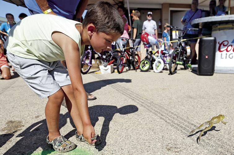 Dozens of kids compete in annual frog jump at second day of Dubuque ...
