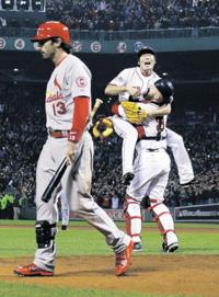 Boston Red Sox relief pitcher Koji Uehara and catcher David Ross celebrate  after getting St. Louis Cardinals' Matt Carpenter to strike out and end  Game 6 of baseball's World Series Wednesday, Oct. …