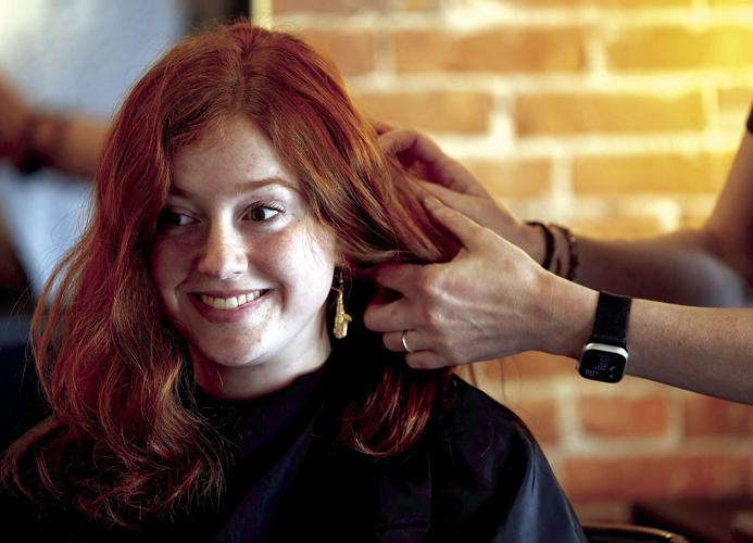 Biz Buzz New Dubuque salon makes downtown debut; dog groomer opens
