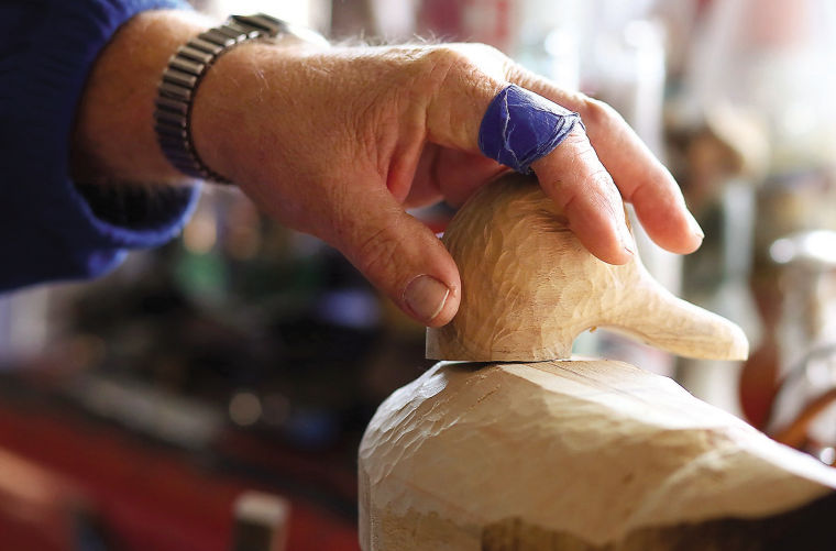 Steve Kerper's handcarved, shiny duck decoys stand out among the