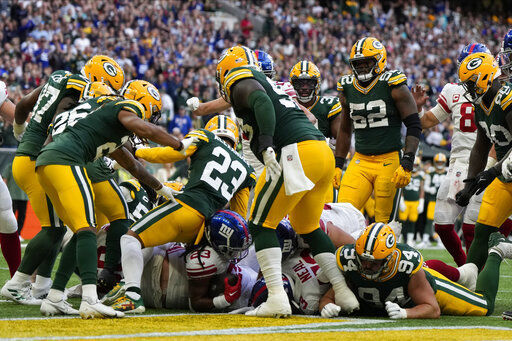 New York Giants running back Gary Brightwell (23) runs up the field during  an NFL football game against the Green Bay Packers at Tottenham Hotspur  Stadium in London, Sunday, Oct. 9, 2022.