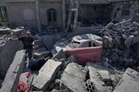 Israeli drone strikes near Beirut kill 4 and southern airstrikes leave at least 13 others dead