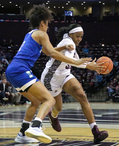 Jasmine Franklin dribbles past her opponent