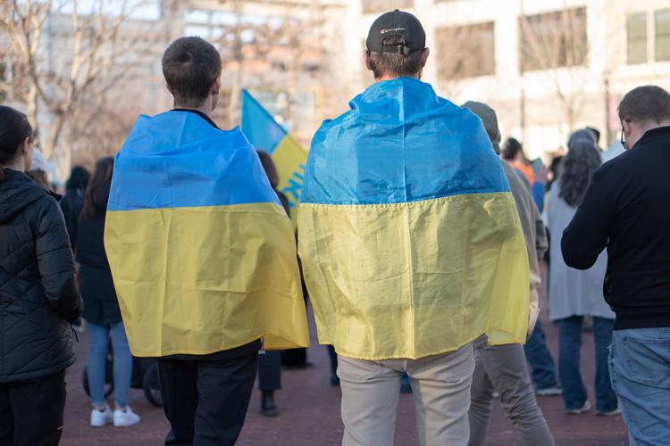 Men wear Ukrainian flag