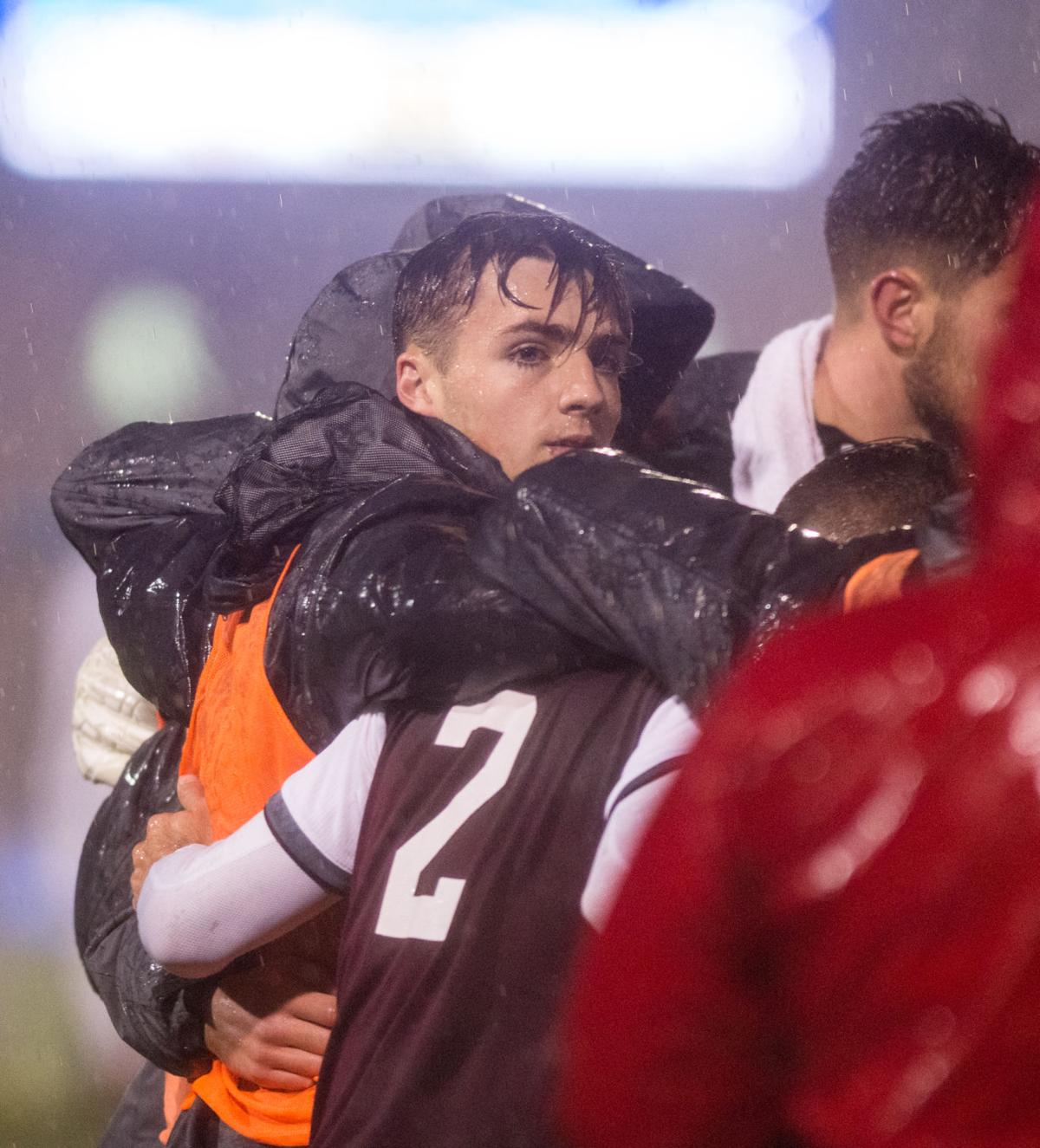 men's soccer team huddles up