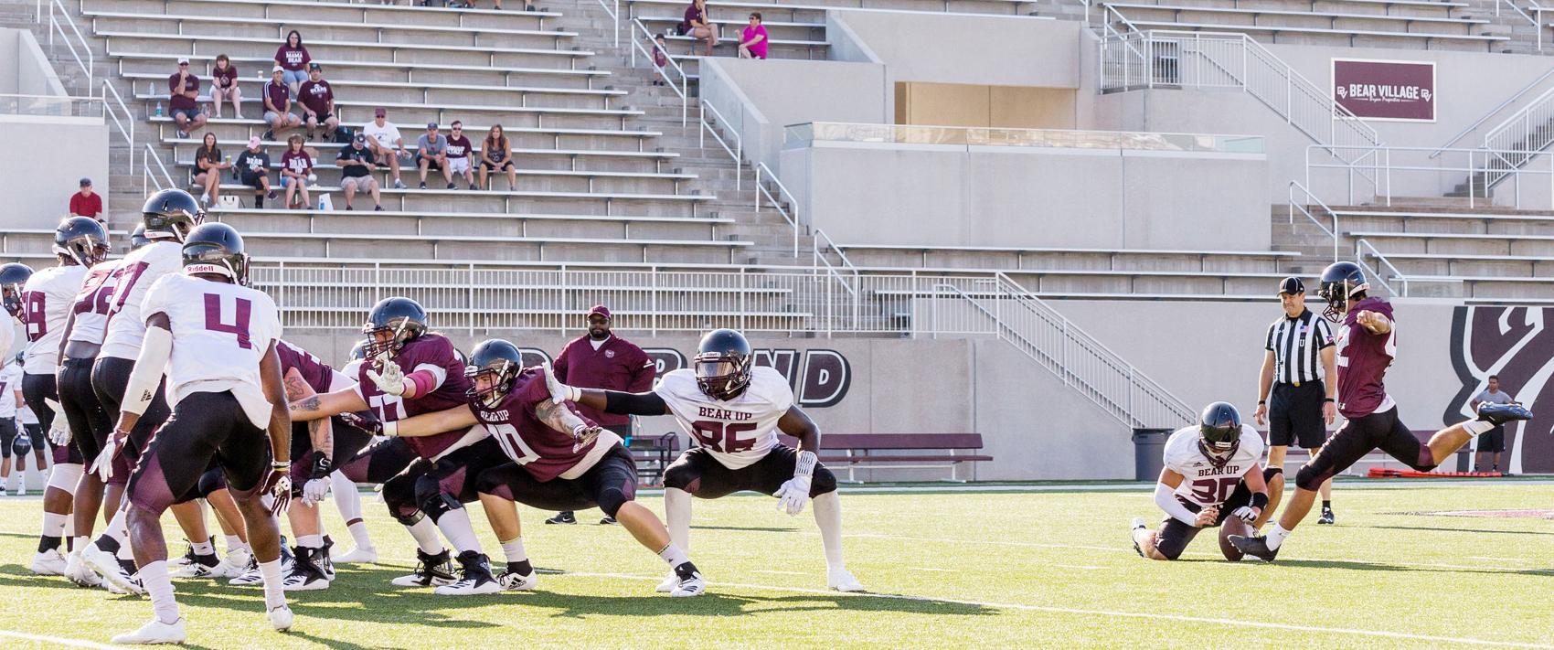 Nick Williams kicks a field goal during the maroon and white scrimmage