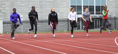 The MSU Bears track team warms up before practice