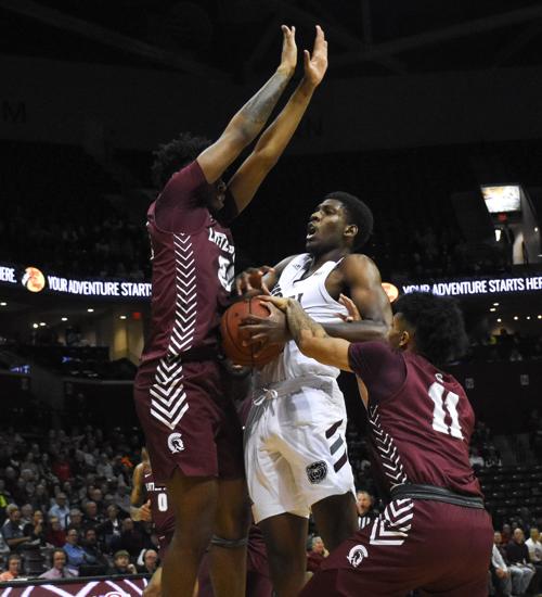 Lamont West attempts to push past defenders