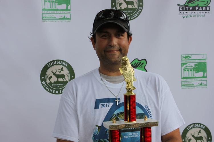 City Park Big Bass Rodeo Former park record holder Tim Zissis hauls in