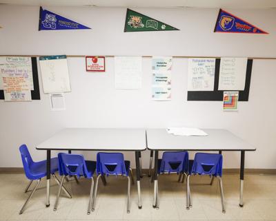 Empty school desks hallway (Copy)