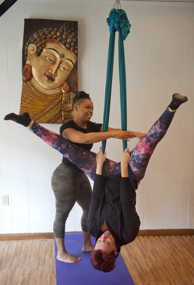 What is Aerial Yoga? Benefits, Best Poses and more (2023)