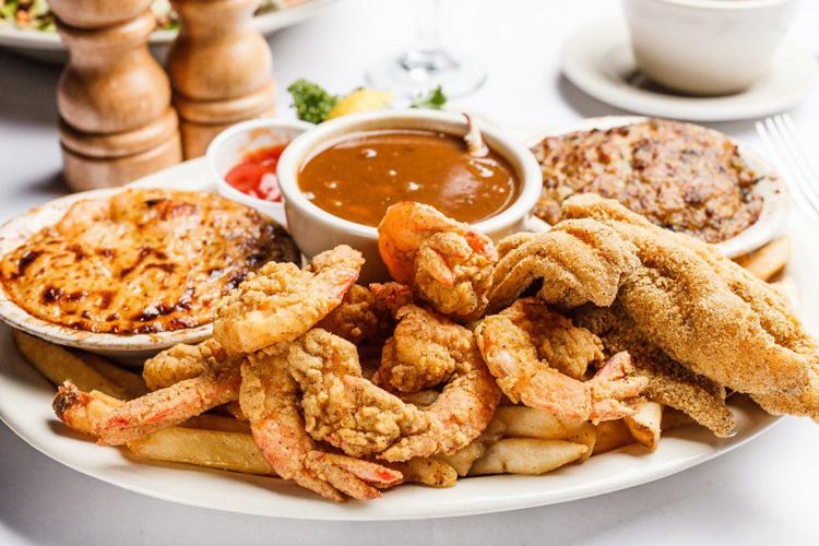 Takeout in Baton Rouge A shrimp platter, a gyro wrap and a triple