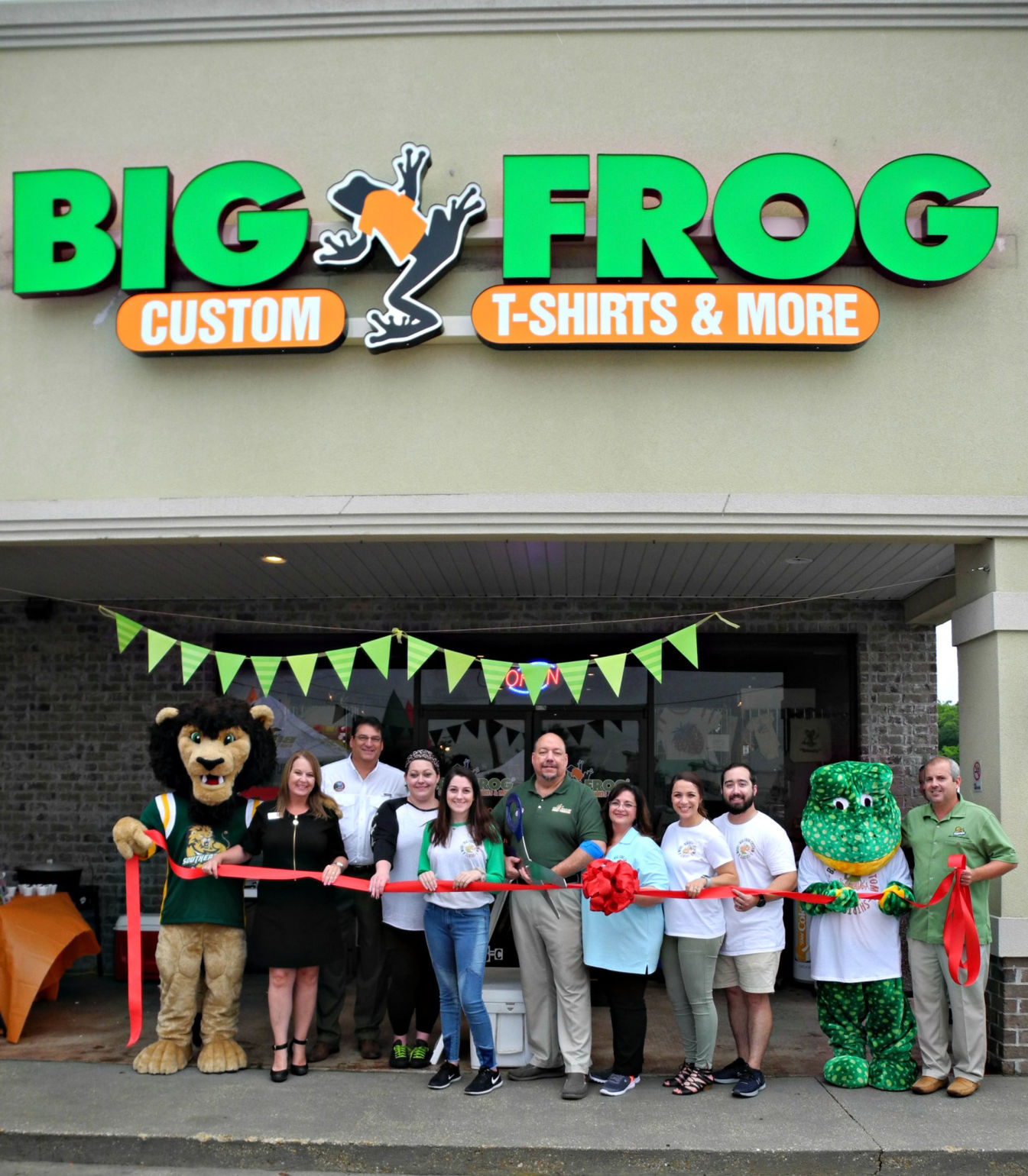 Big Frog Custom T Shirts More holds ribbon cutting Livingston