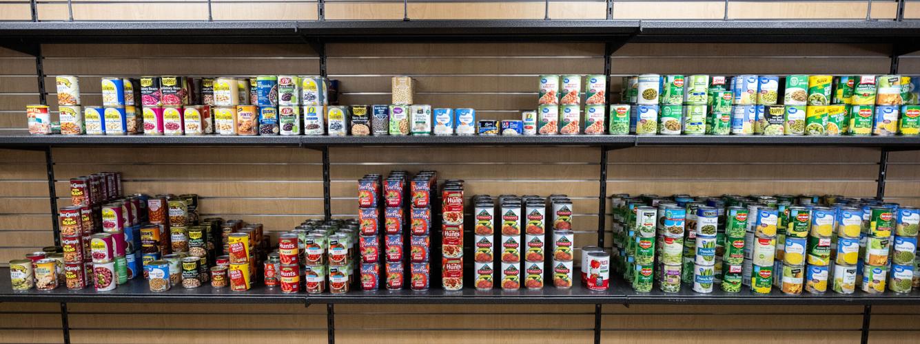 UL food pantry, clothing outlet stocks shelves, racks to serve students