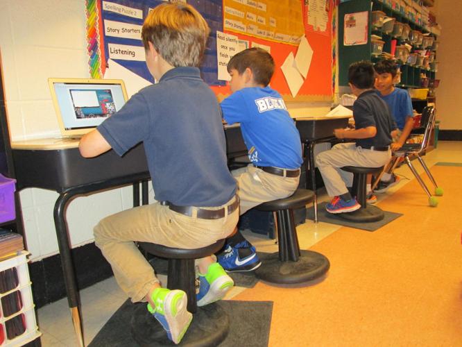 Oak Grove Primary thirdgraders wobble while they work on Kore Wobble