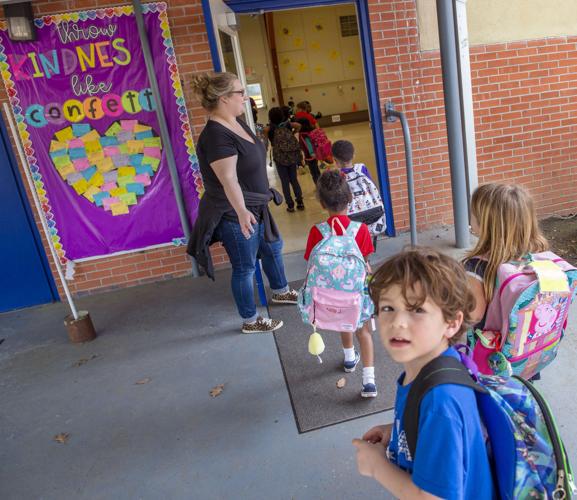 Tears at Baton Rouge school after governor closes schools amid