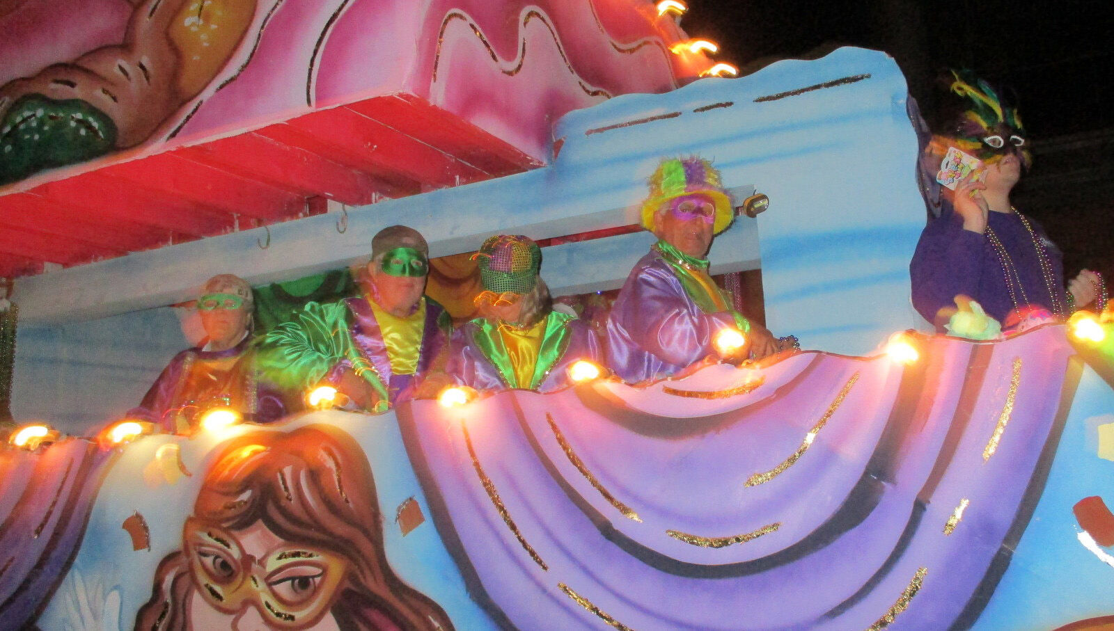 Colorful floats roll in Krewe of Omega s parade Livingston