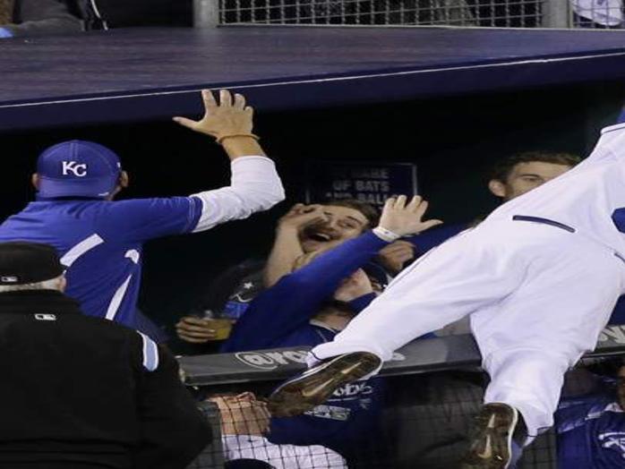 Moustakas goes over the railing to make the catch : r/baseball