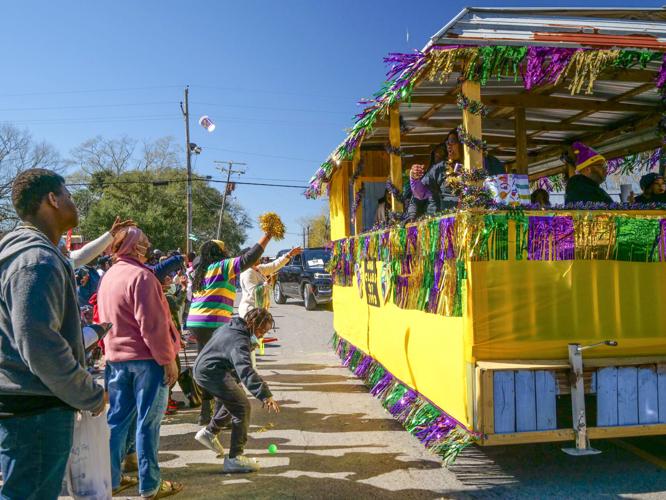 Carnival returns to Clinton as Mardi Gras parade rolls through town