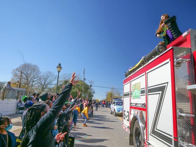 Carnival returns to Clinton as Mardi Gras parade rolls through town